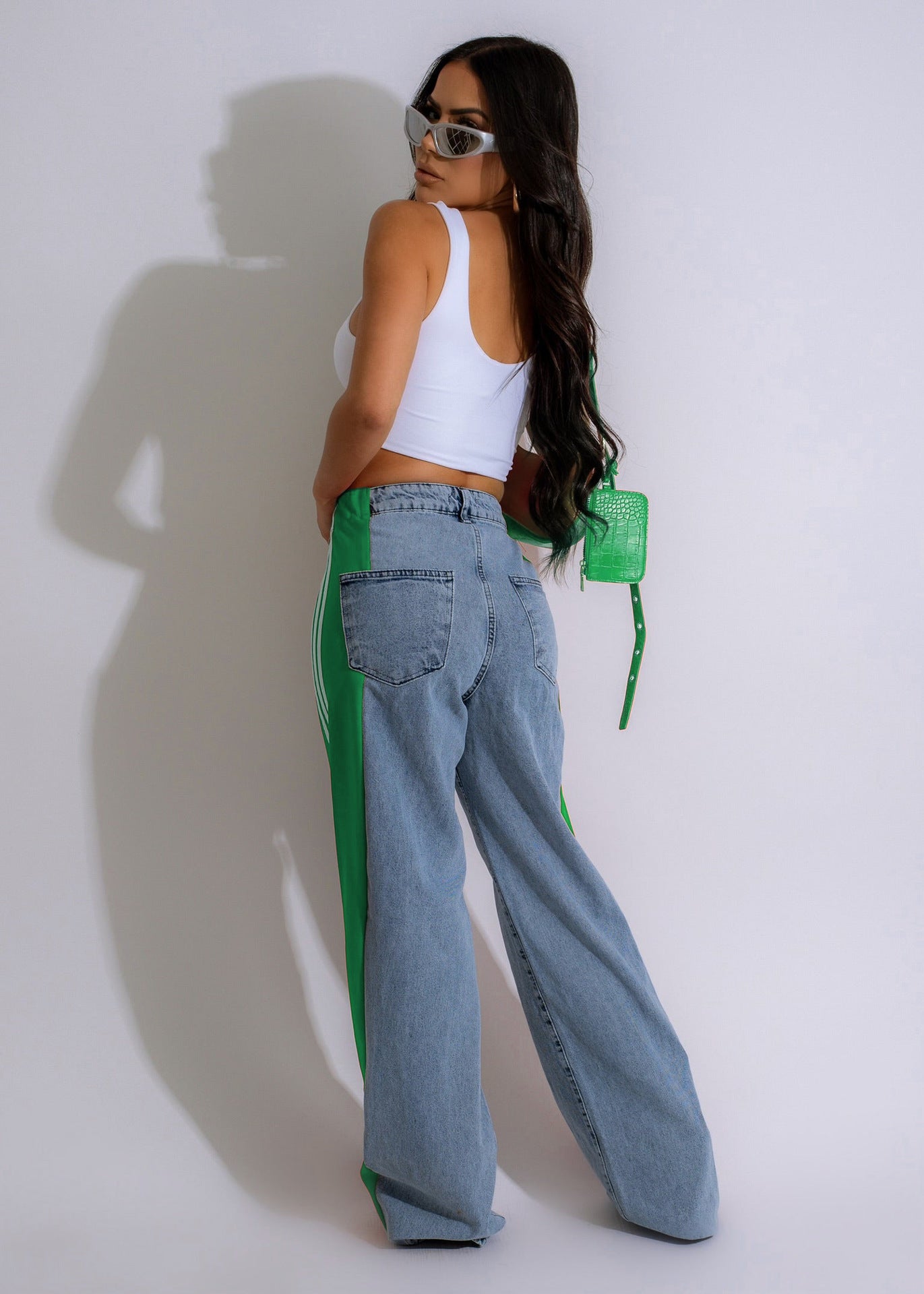 Wide-leg light blue denim jeans with neon green stripes for fashionable casual wear