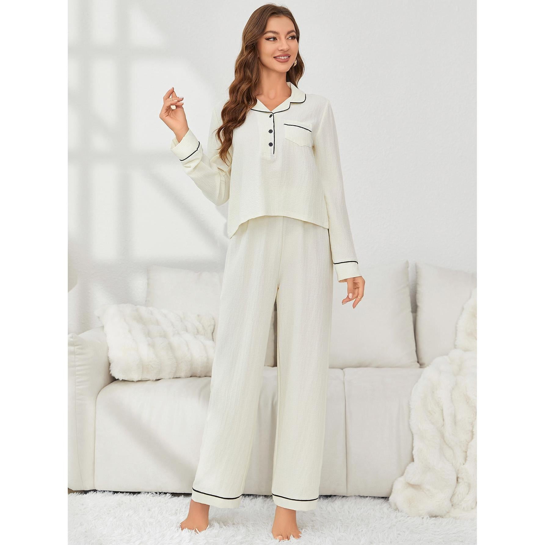 Elegant woman in cream-colored pajama set with black piping, ideal for fashion and ملابس