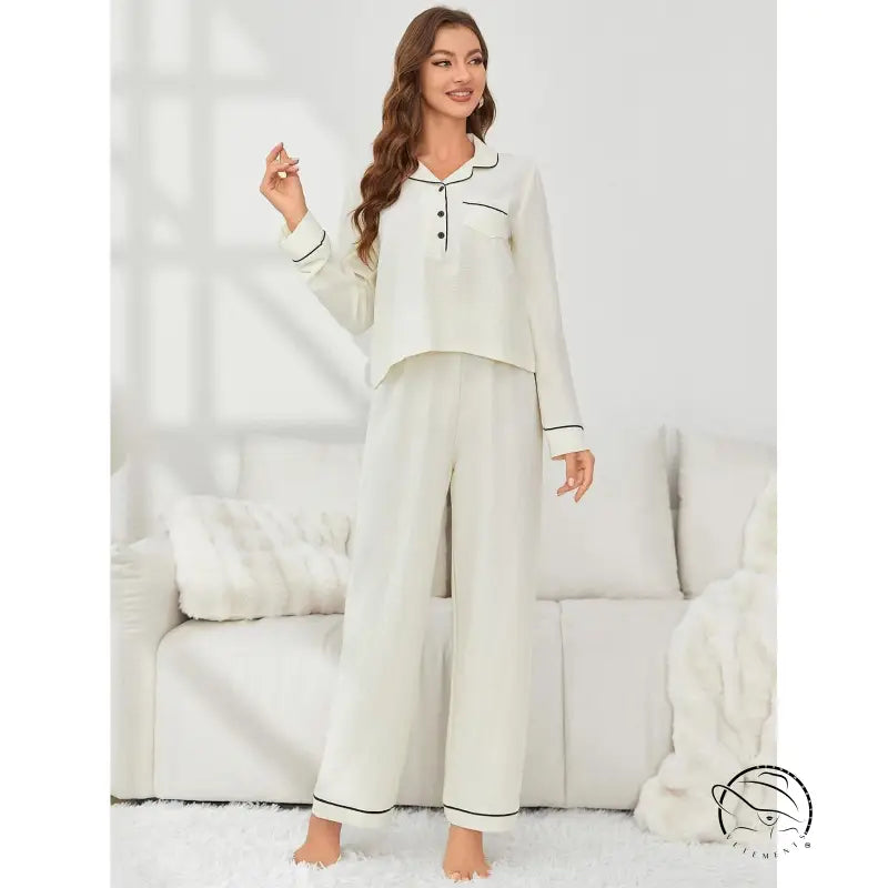 Woman in cream langry fashion pajamas with black piping, autumn winter set