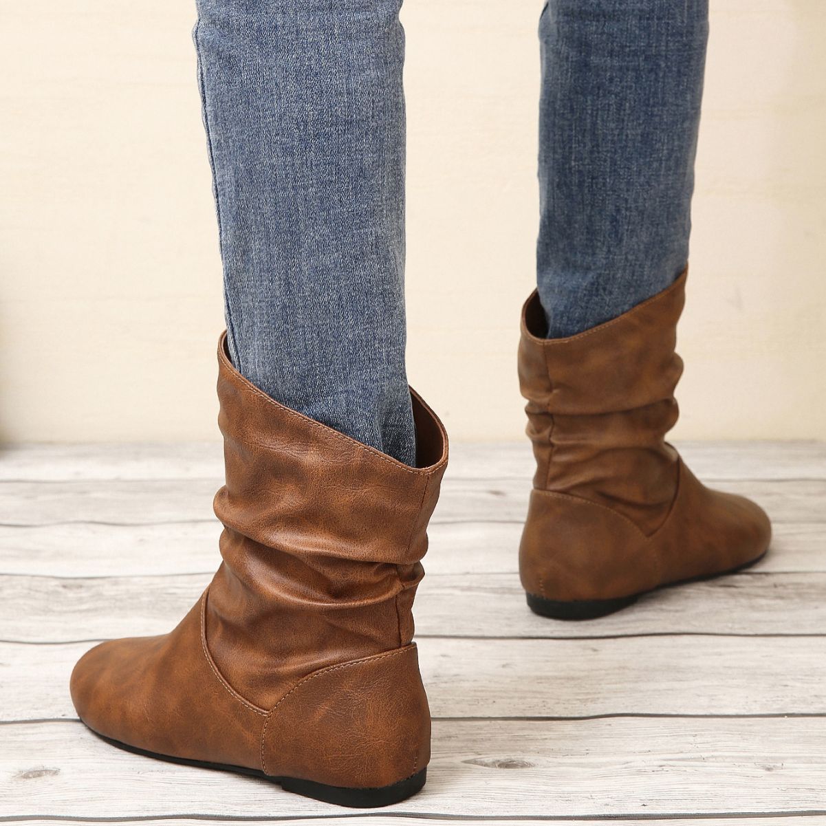 Brown slouch ankle boots for women in stylish faux leather, enhancing fashion ملابس