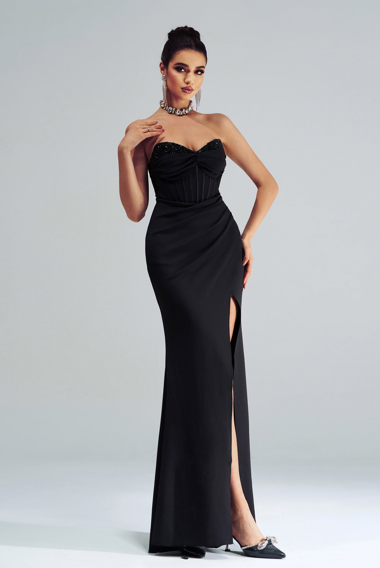 Elegant black strapless evening gown with thigh-high slit for stunning langry fashion