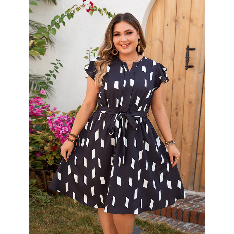 Woman in a patterned Comfortable Tight Waist Dress showcasing elegant fashion style