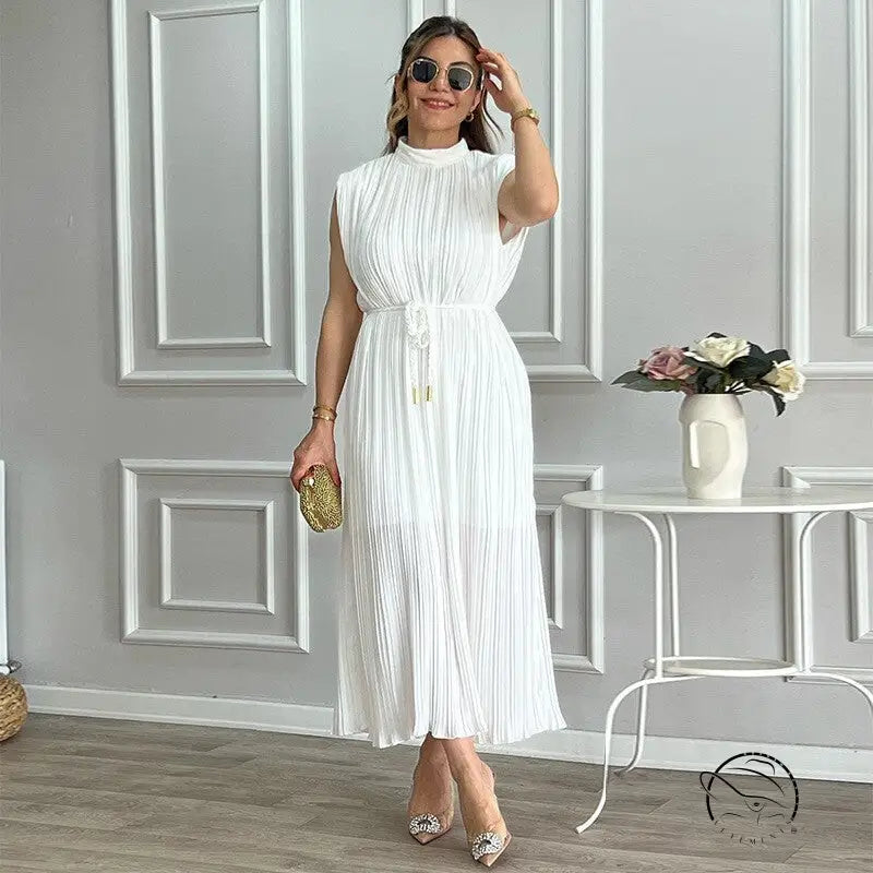 White pleated mid length dress with waist control and lace up details