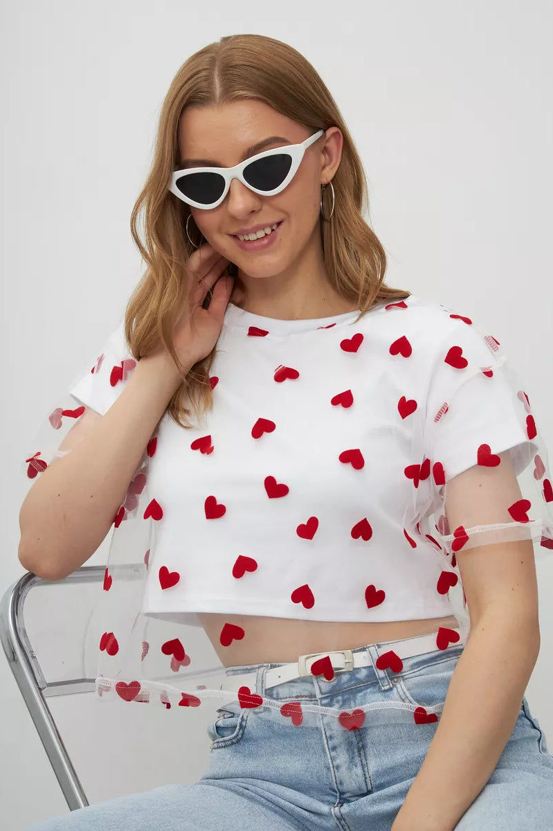 White crop top with sheer puff sleeves and red heart pattern, perfect for elegant fashion ملابس