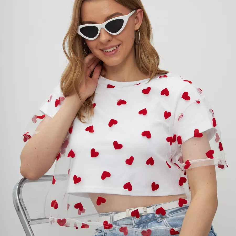 White crop top with sheer puff sleeves and red heart pattern, perfect for elegant fashion ملابس
