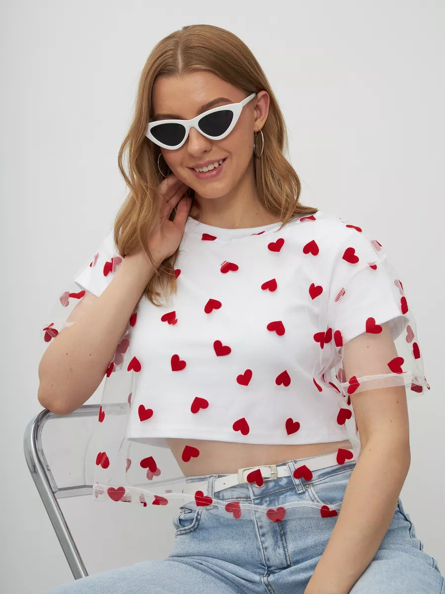White crop top with sheer puff sleeves and red heart pattern, perfect for elegant fashion ملابس