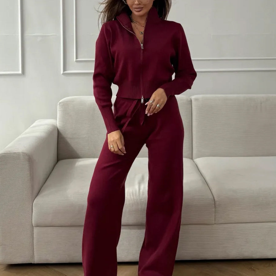 Langry fashion burgundy zip-up jumpsuit with wide-leg pants and white sneakers