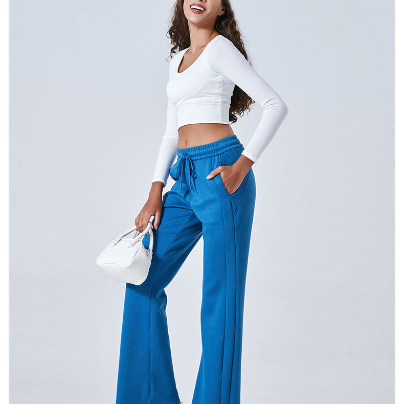 Bright blue flared pants with white cropped top ideal for Summer Air Layer fashion ملابس