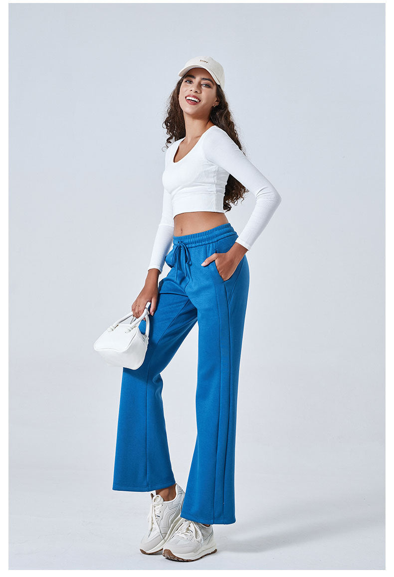 Bright blue flared pants with white cropped top ideal for Summer Air Layer fashion ملابس