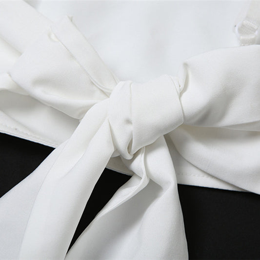 White fabric tied in a knot on a Summer Women Wear Camisole Knotted Short Top set