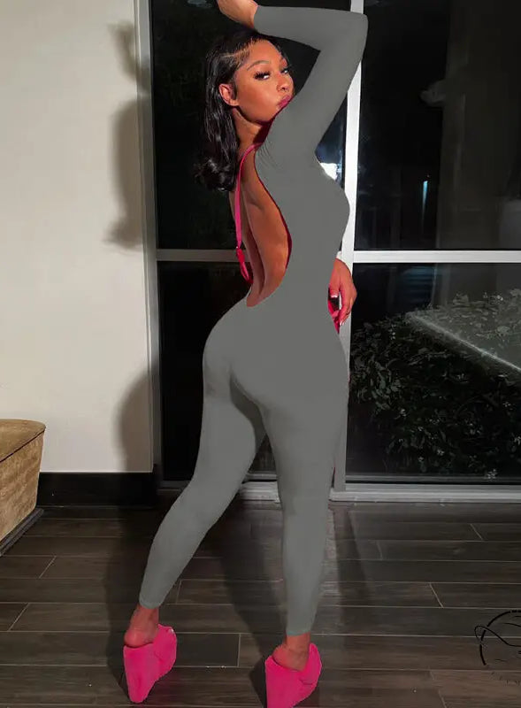 Gray backless slim fit jumpsuit with pink shoes