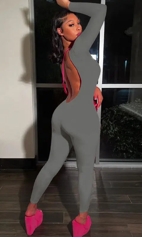 Gray backless slim fit jumpsuit with pink shoes