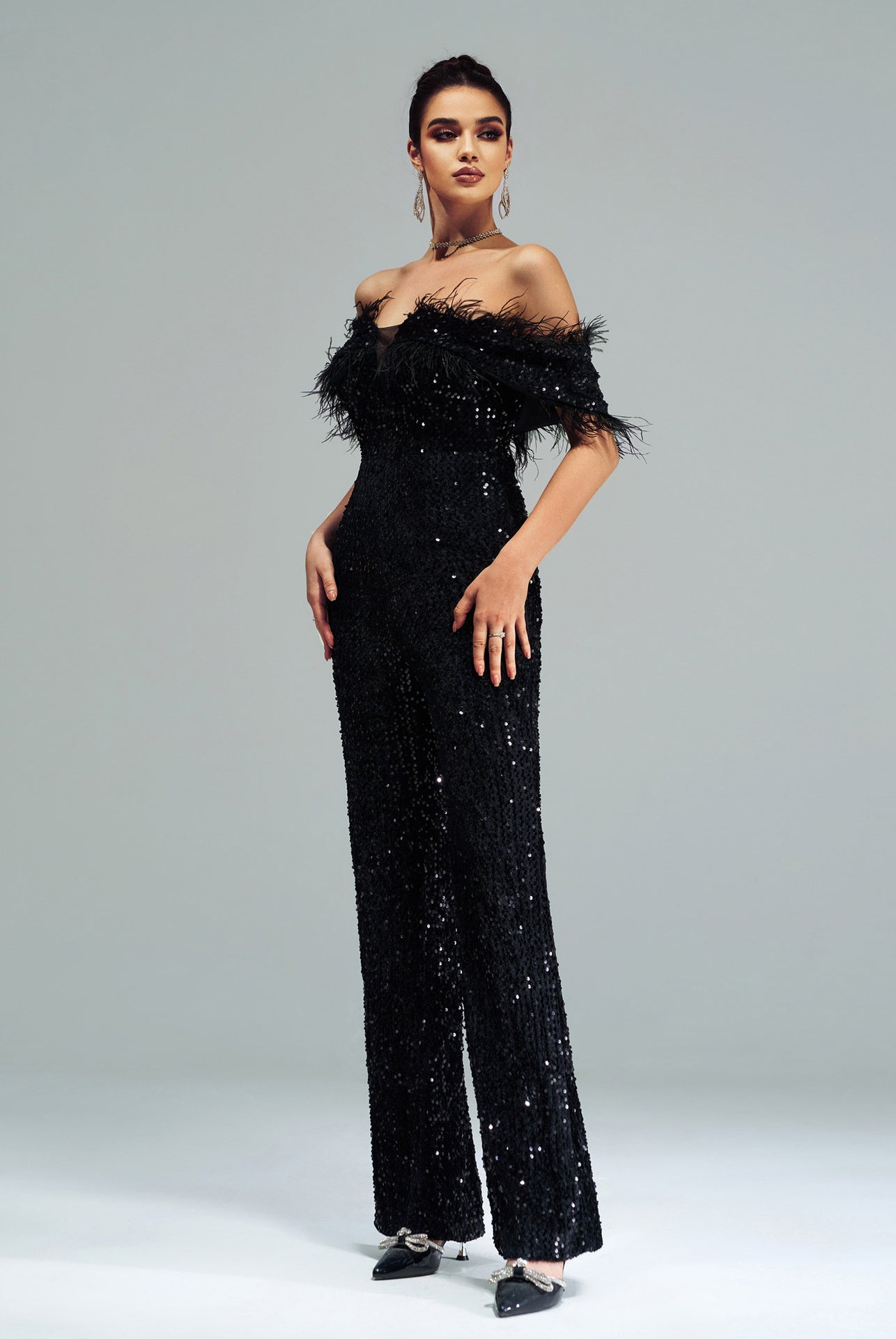 Elegant black sequined jumpsuit with feathered neckline from High End Cocktail Jumpsuit collection, perfect for stylish fashion events