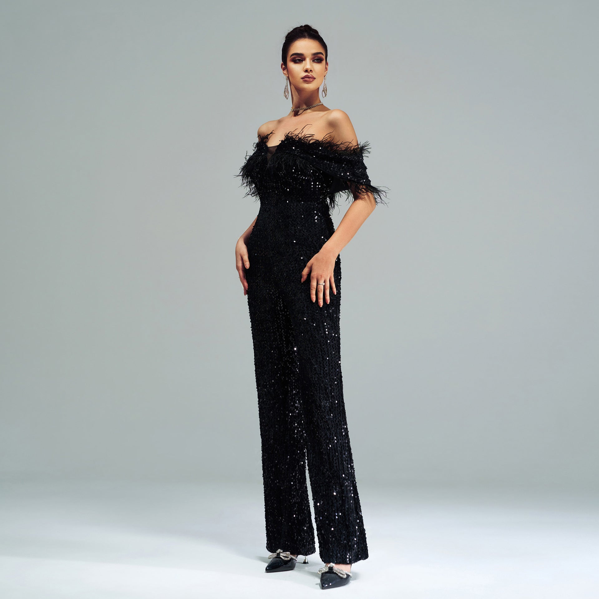 Elegant black sequined jumpsuit with feathered neckline from High End Cocktail Jumpsuit collection, perfect for stylish fashion events