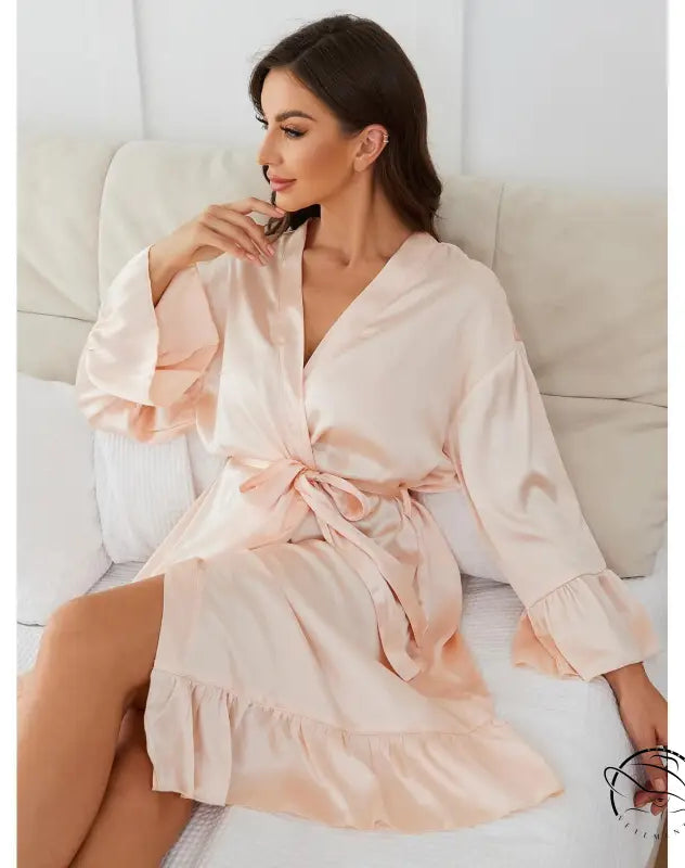 Light pink satin long sleeve robe with tie waist and ruffled hem