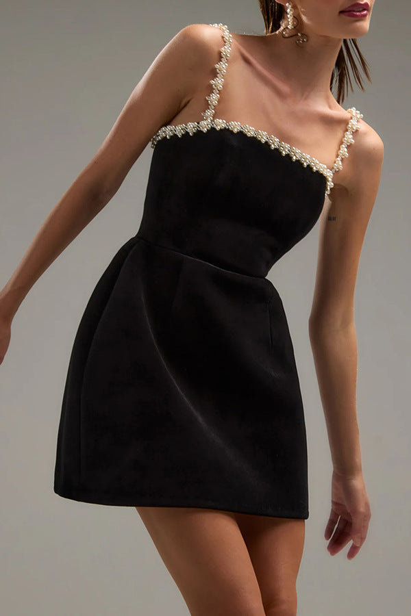 Elegant pearl trim black mini line dress showcasing luxurious langry fashion style