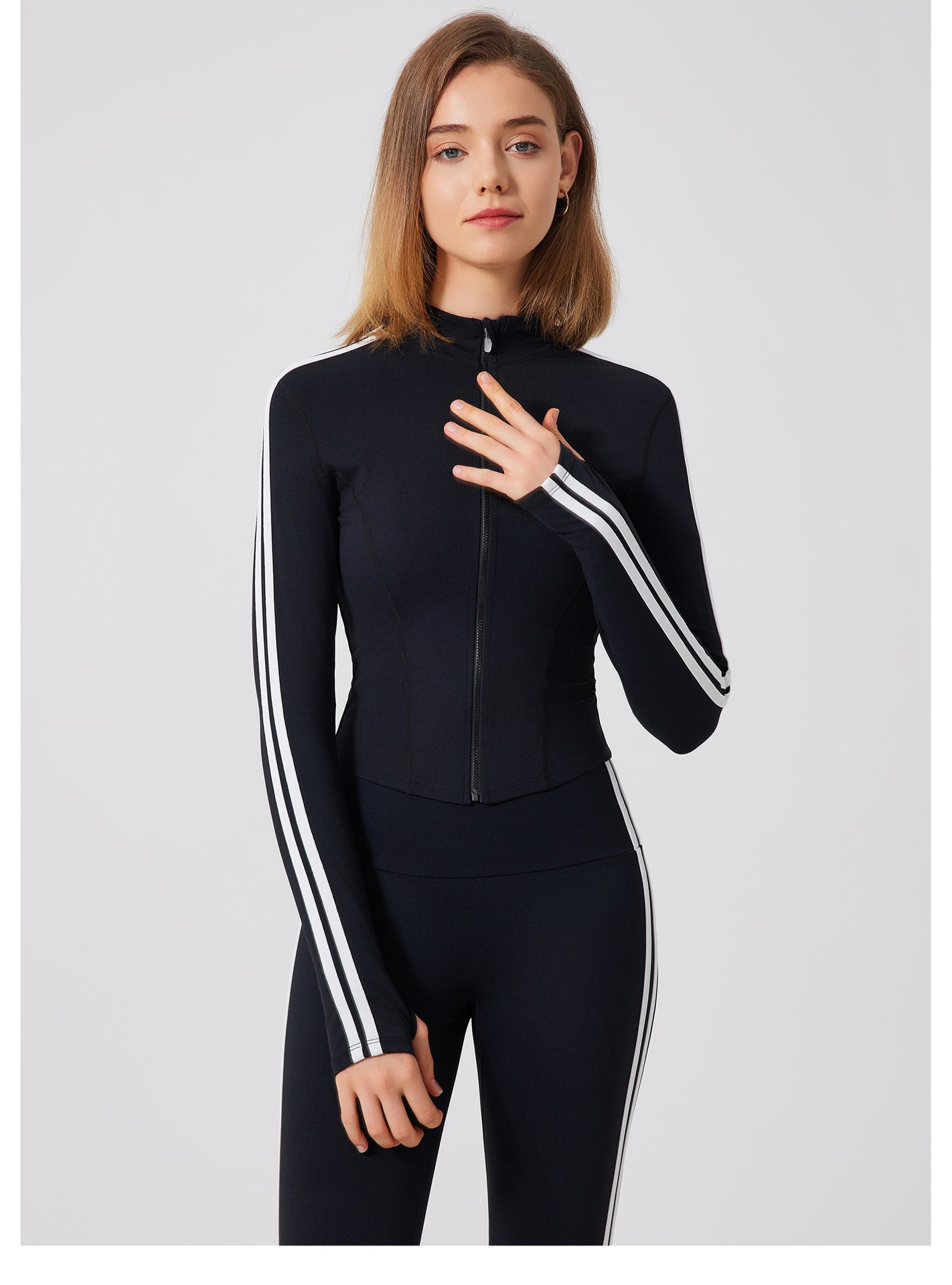 Black Adidas tracksuit in running skin friendly fitness top with white stripes and zipper