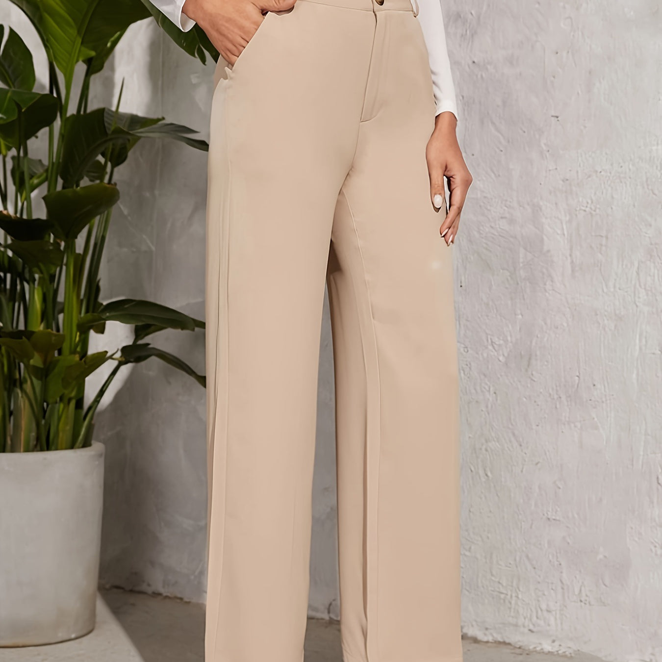 High-waisted beige wide-leg trousers with side pockets for elegant fashion styling