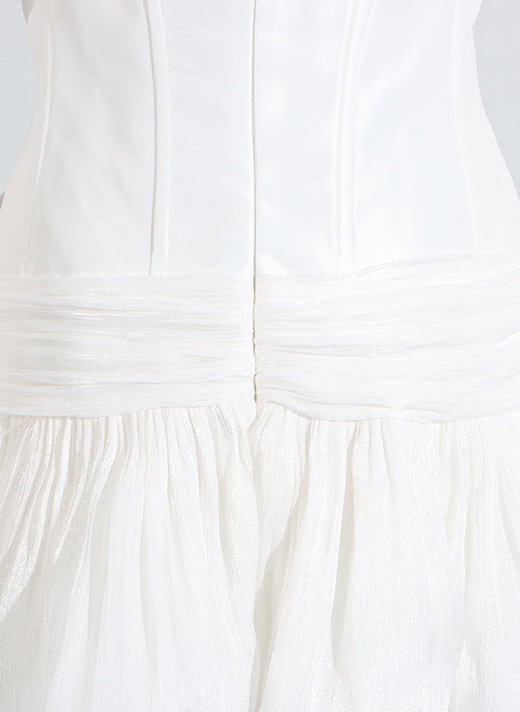 White langry cotton summer dress with ruffled hem and back zipper
