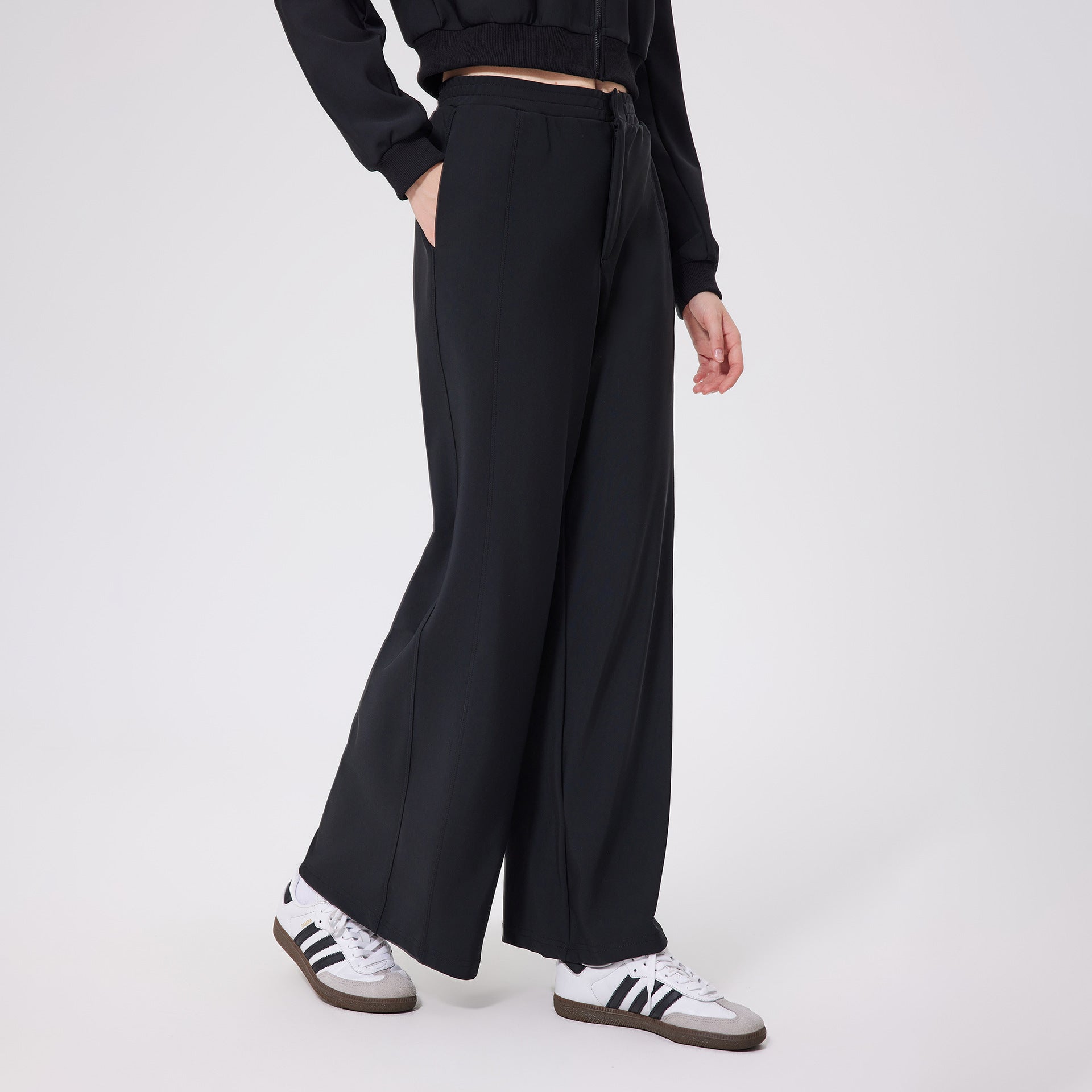 Black loose fitness warm pants with elastic waistband and pockets