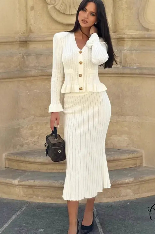 Woman in elegant classic dress and white knit skirt suit