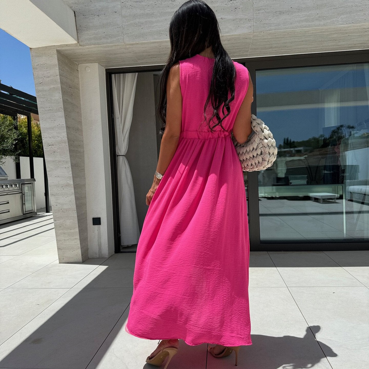 Women wearing a bright pink maxi dress in fashion style, perfect for ملابس occasions