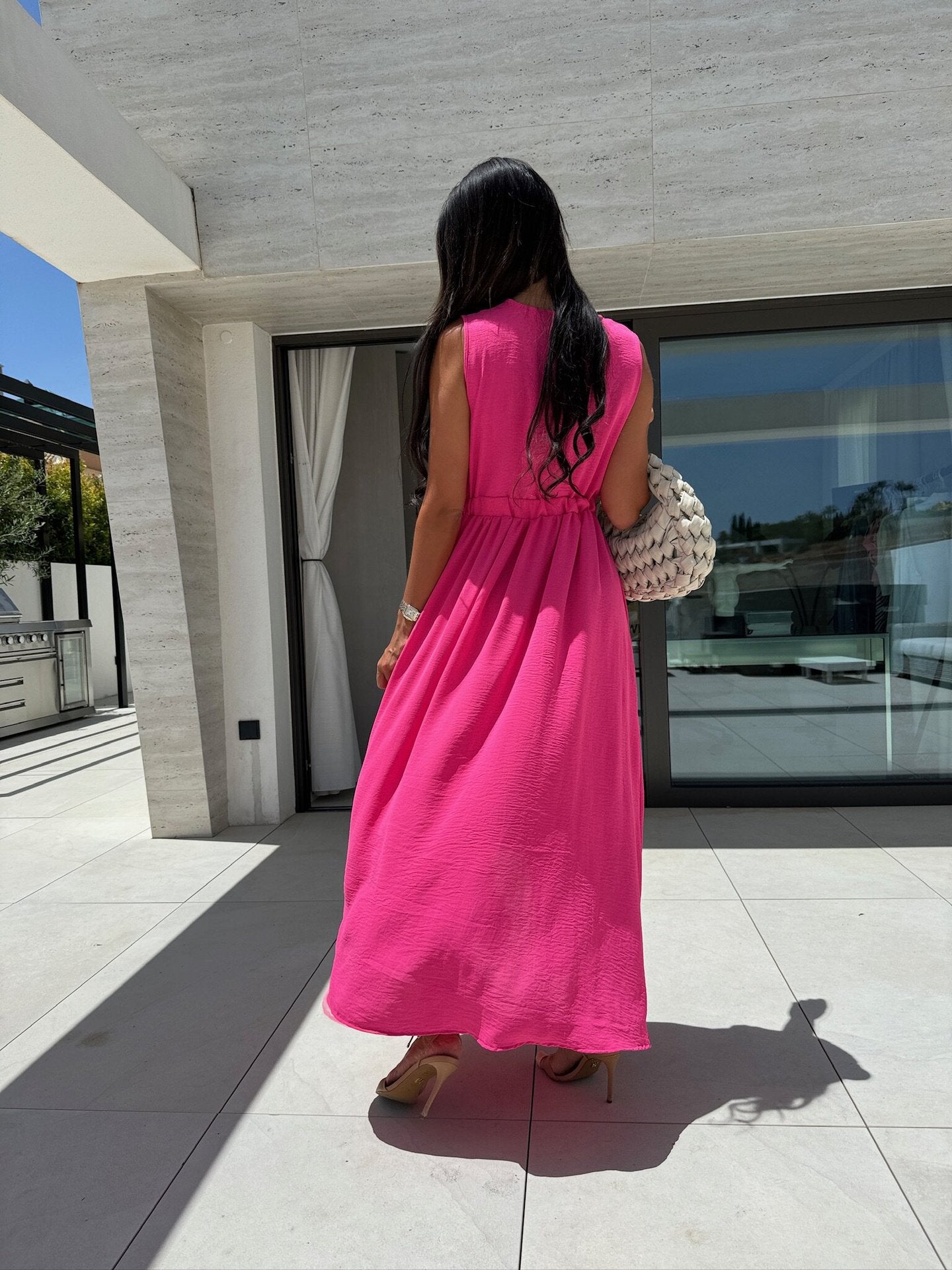 Women wearing a bright pink maxi dress in fashion style, perfect for ملابس occasions
