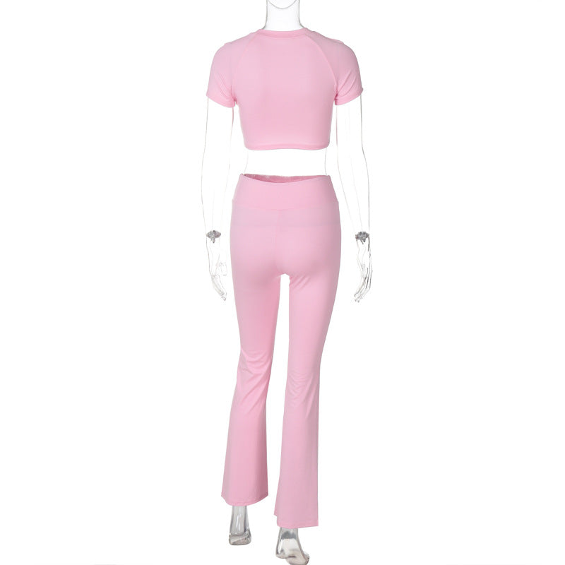 Pink two-piece crop top and flared pants set in slim fit high waist suit for stylish elegance