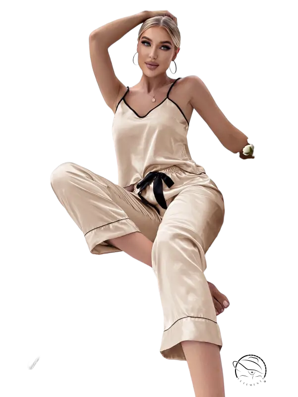 Beige satin pajama set with black trim, tie belt and black eye mask