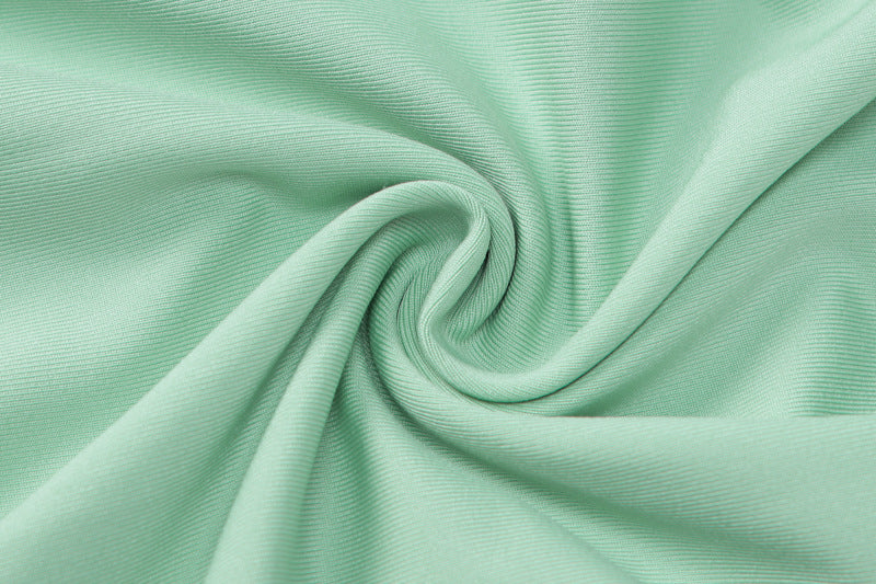 Mint green fabric with swirling pattern featured in langry Backless Slim Fit Jumpsuit