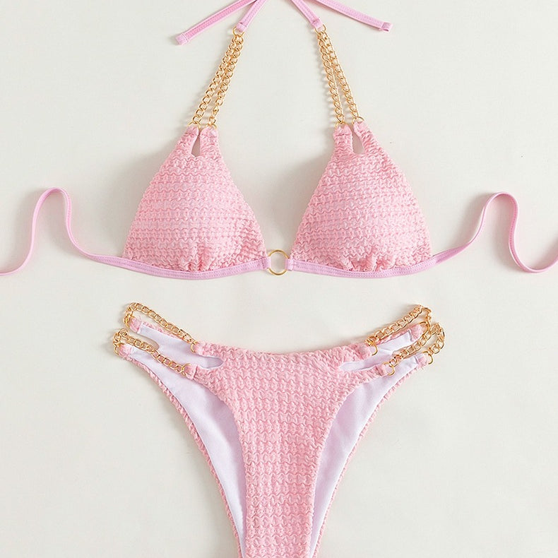 Pink bikini with gold chain accents from the Backless Split Swimsuit collection