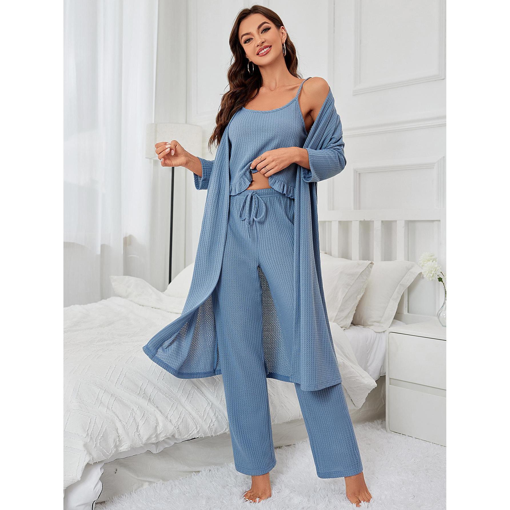 Woman in blue ribbed pajamas set showcasing fashionable ملابس and comfortable home wear