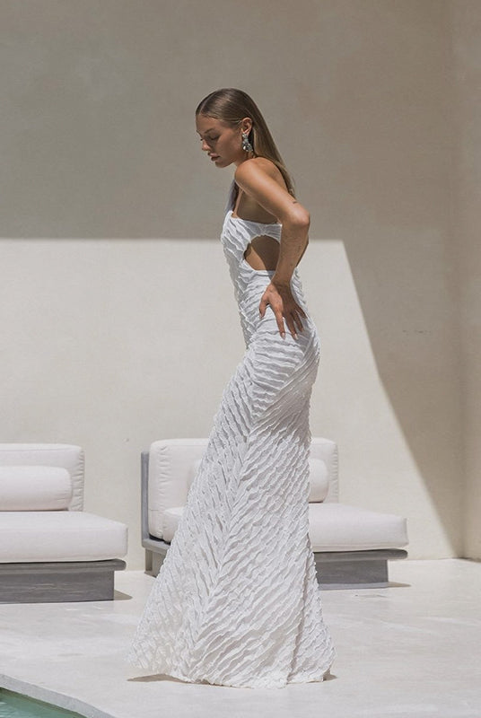 Sleek white wedding gown with geometric sequins, perfect for fashionable brides in ملابس