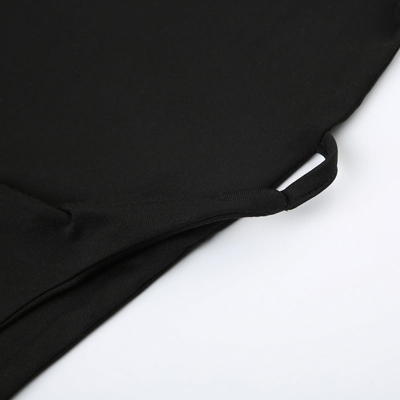 Black fabric garment with cutout square collar and irregular asymmetric collar detail