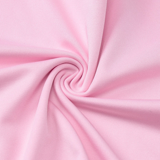 Swirled pink fabric detail on slim fit high waist suit showcasing elegant design