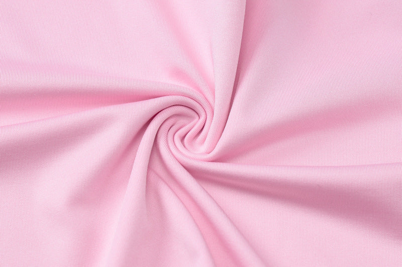 Swirled pink fabric detail on slim fit high waist suit showcasing elegant design