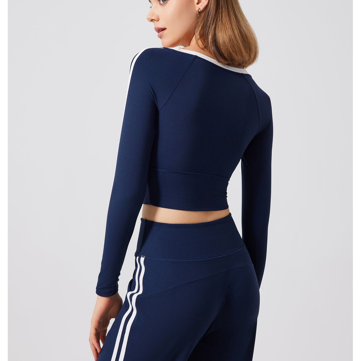 Navy blue athletic crop top and pants with white stripes, stylish sportswear for langry fashion