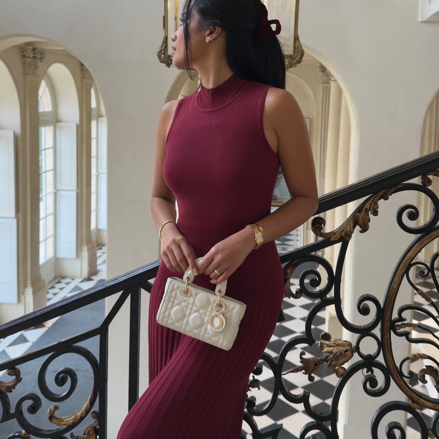 Sleeveless burgundy ribbed bodycon maxi dress with mock neckline for fashionable styling