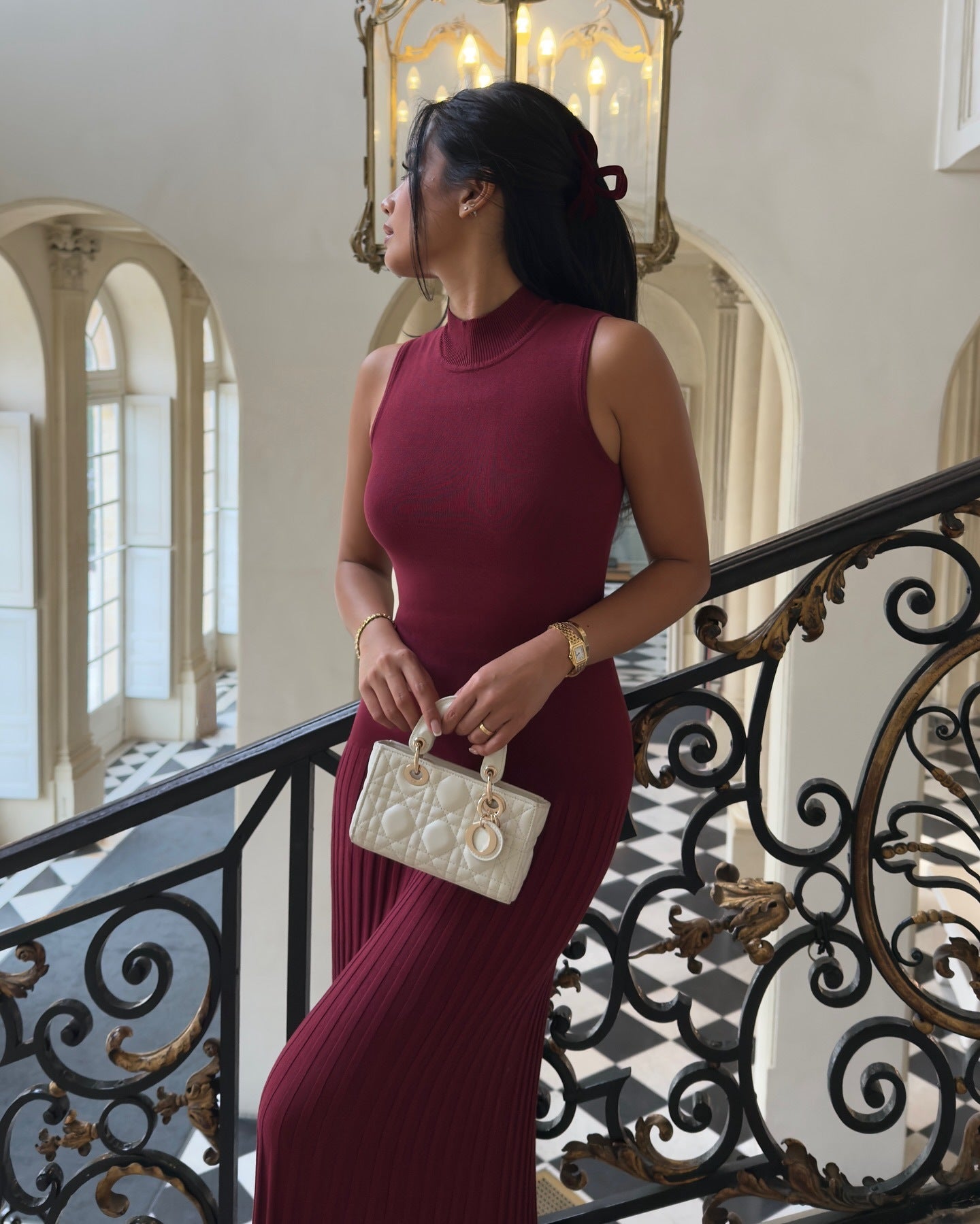 Sleeveless burgundy ribbed bodycon maxi dress with mock neckline for fashionable styling