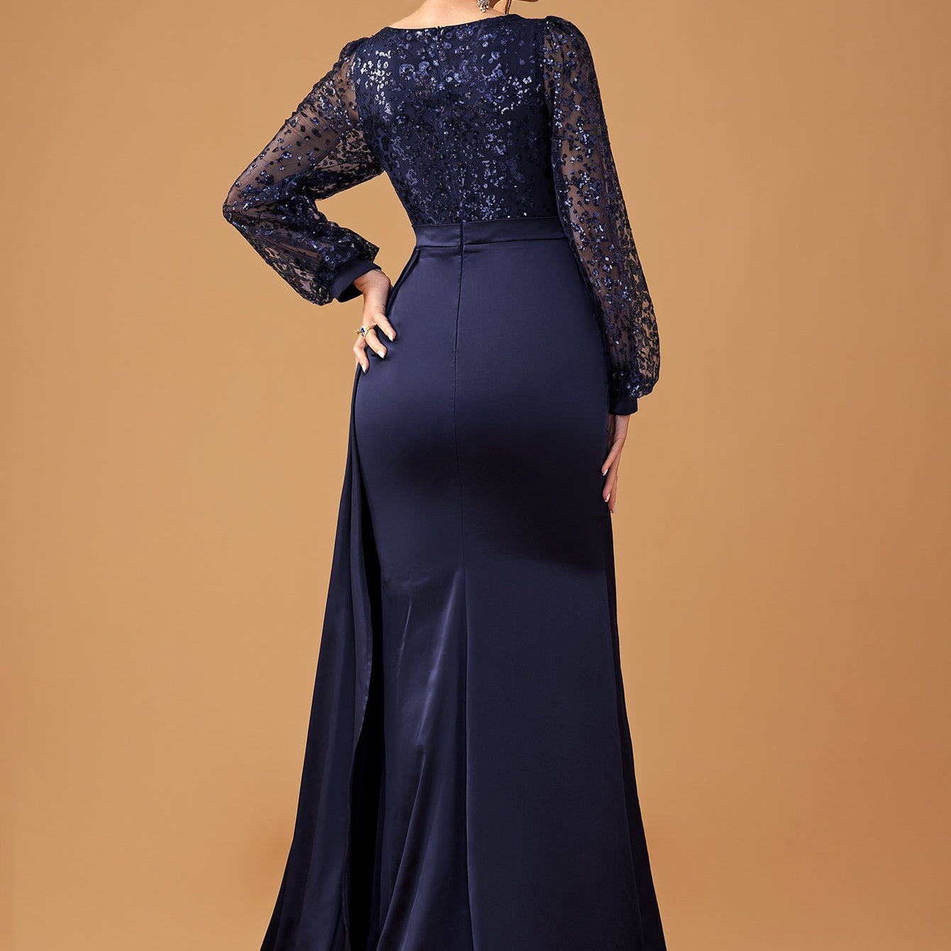 Navy blue sequined long-sleeved gown showcasing elegant evening fashion ملابس