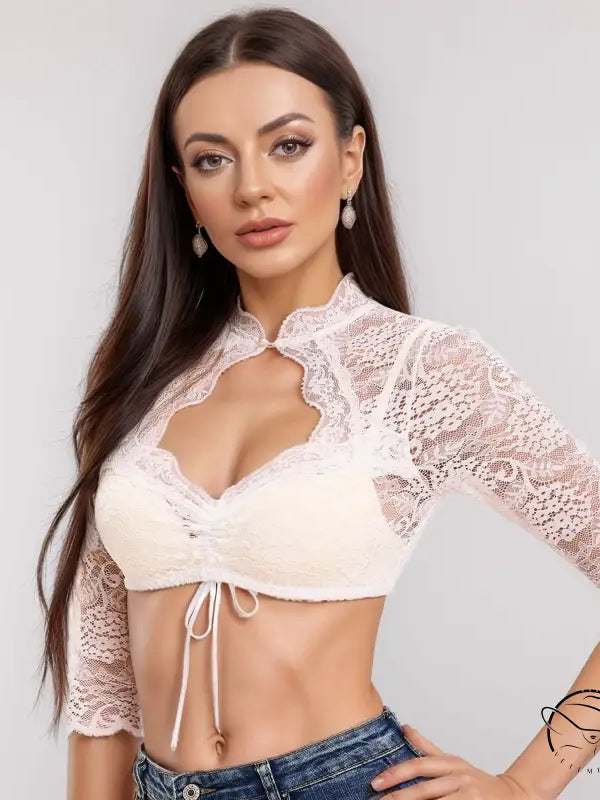 Cream lace crop top with high neckline, tie front, and lace stitching for beer festival