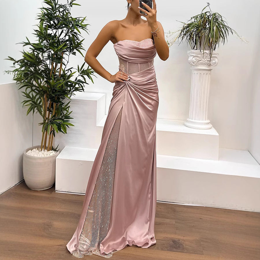 Elegant pink satin gown with embellished slit for casual fashion occasions, embodying luxury and style