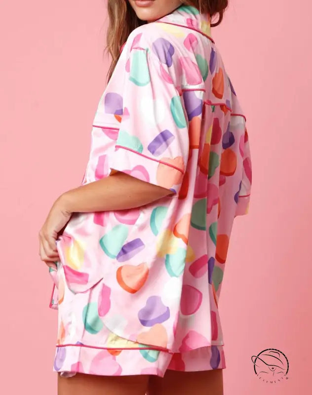 Cute two piece set pajamas in pink with candy hearts print and red piping
