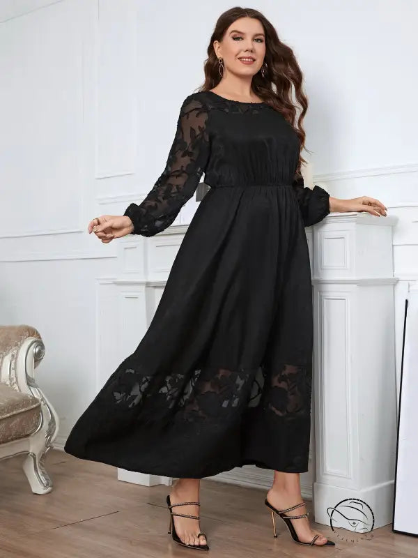 Elegant lace dress with black floral accents, maxi style
