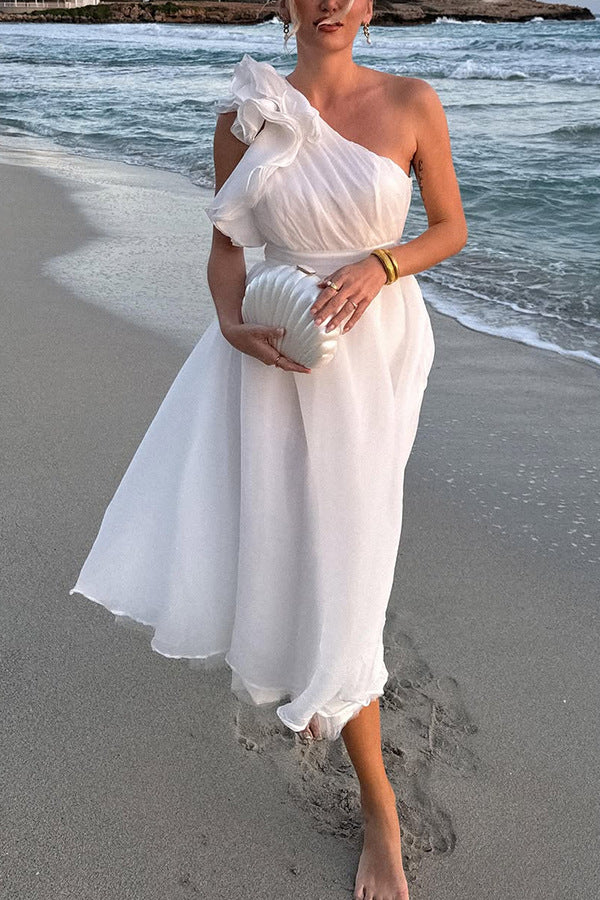 Elegant one-shoulder white dress with ruffles and a flowing midi skirt in langry fashion