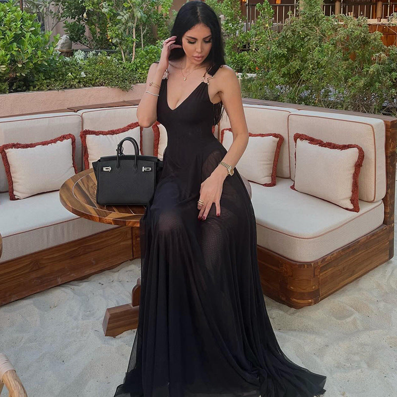 Elegant langry black silk slip dress with spaghetti straps and deep V-neck