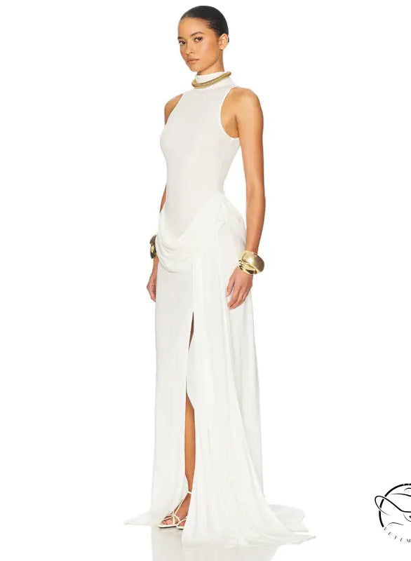 White high-neck gown with high split, tight waist and gold accents