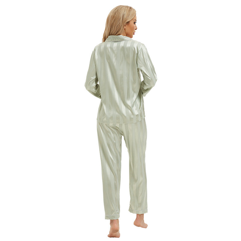 Shimmering sage green satin langry pajamas with bold vertical stripes