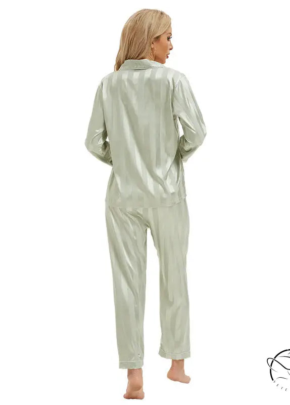Shimmering sage green satin pajamas with bold stripes in langry fashion