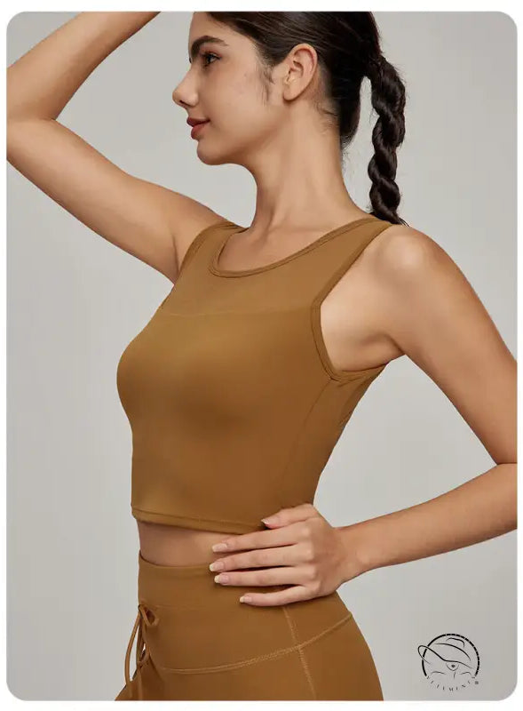 Woman in Langry Beauty Back mesh workout top and high-waisted bottoms